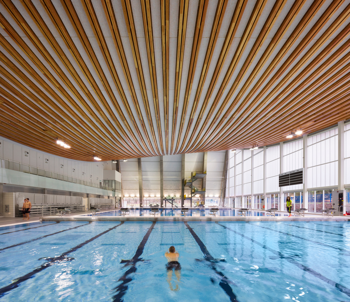 Interior view of Grandview Heights Aquatic Centre showing glue-laminated timber (glulam) prefab roof assembly