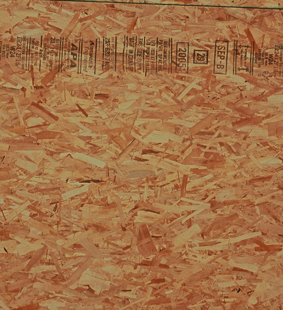 Close up view of oriented strand board (OSB) sheet product showing individual strands