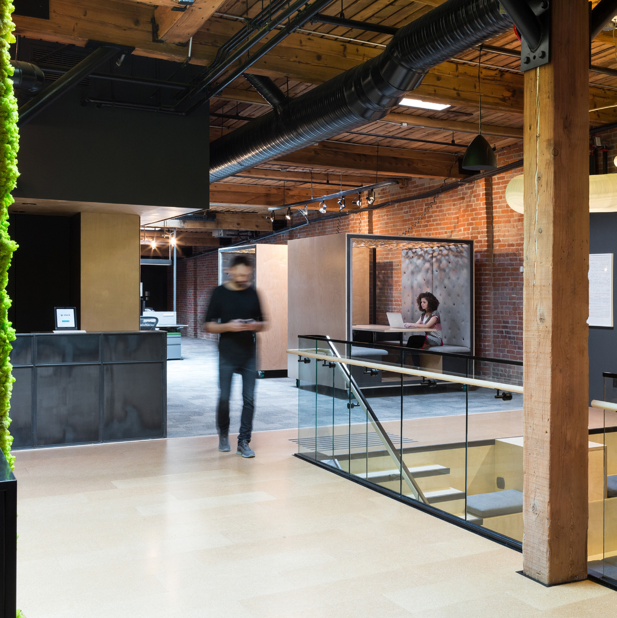 Interior image of contemporary open format Slack Headquarters in Vancouver showing post + beam, nail-laminated timber (NLT) and solid-sawn heavy timber elements